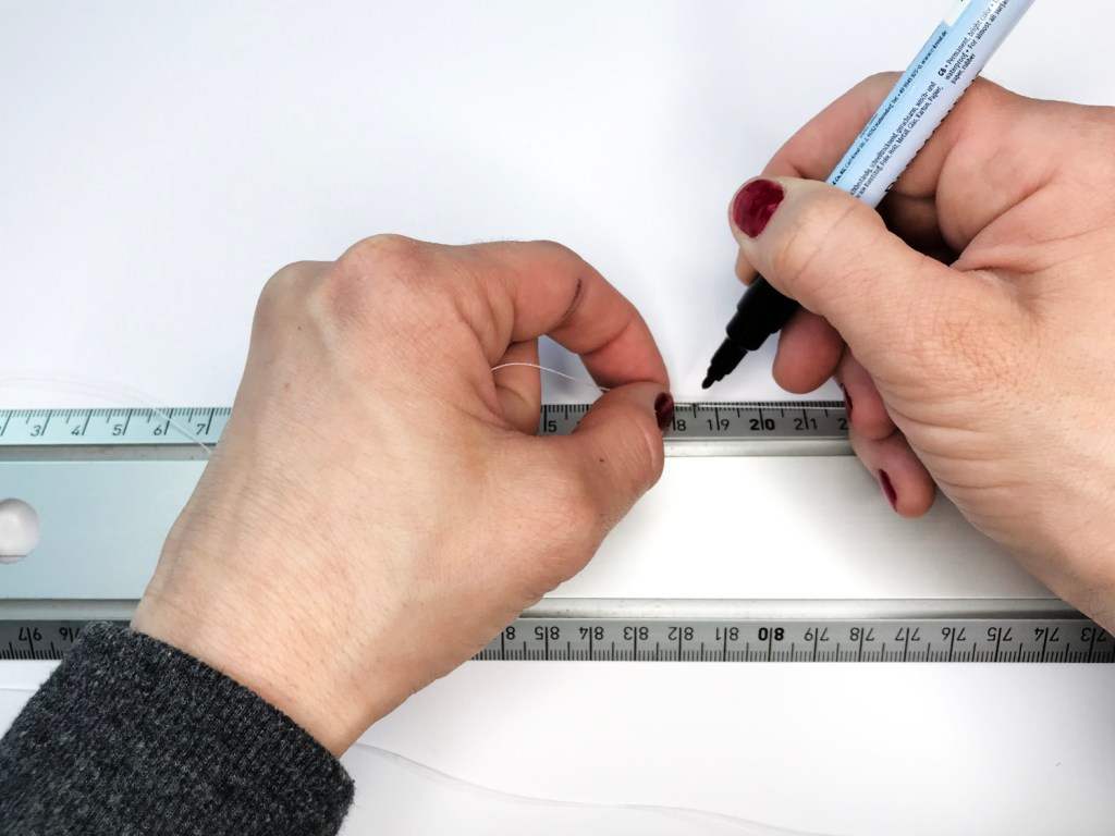 Measuring the length of string for skirt hem.