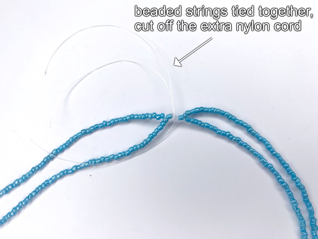 Beaded necklaces tied together.