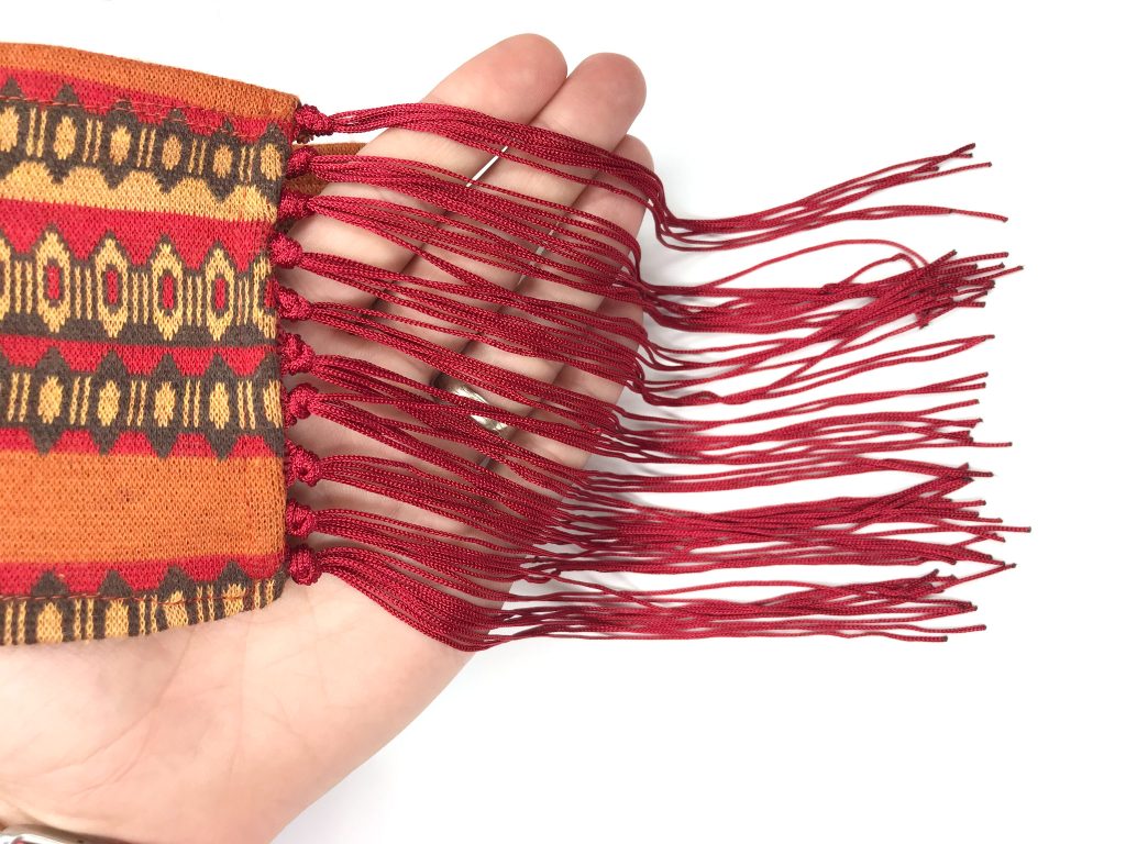 Fringe trim divided into chunks of six fringe strings made for decoration.
