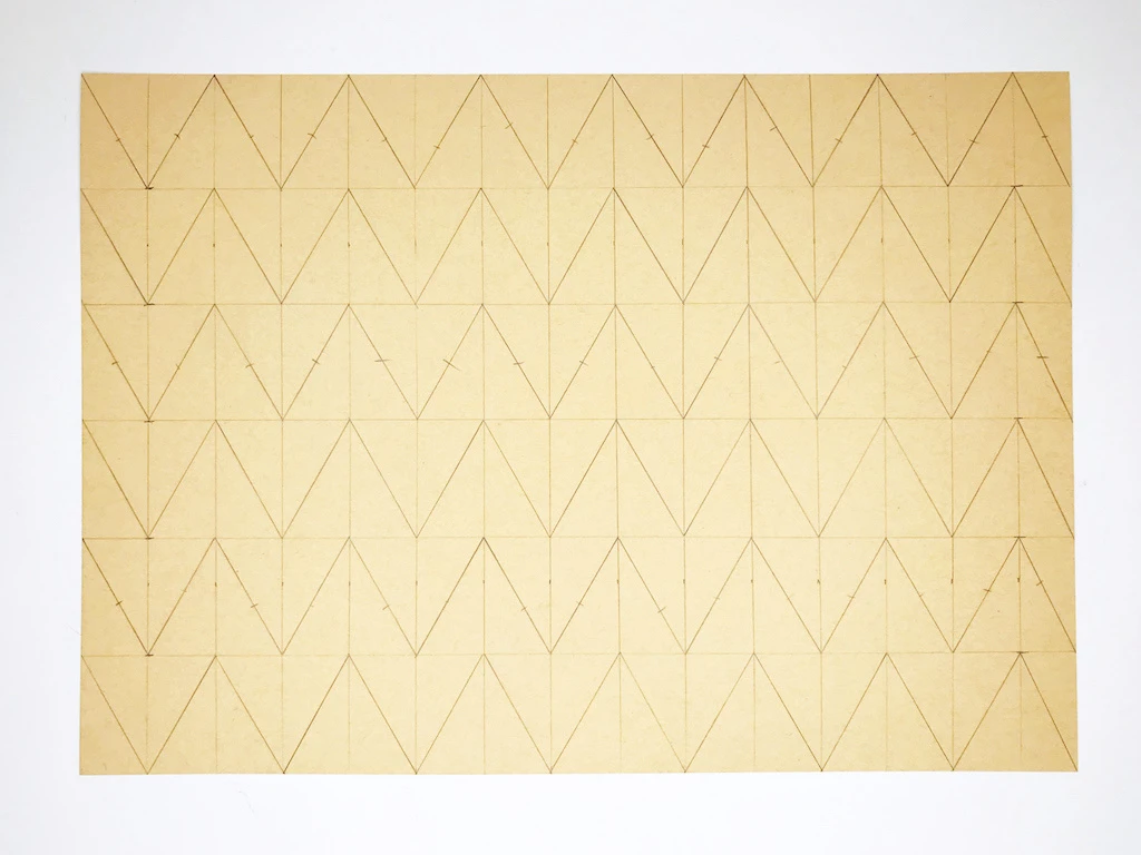 Complete template for permanently pleated fabric.