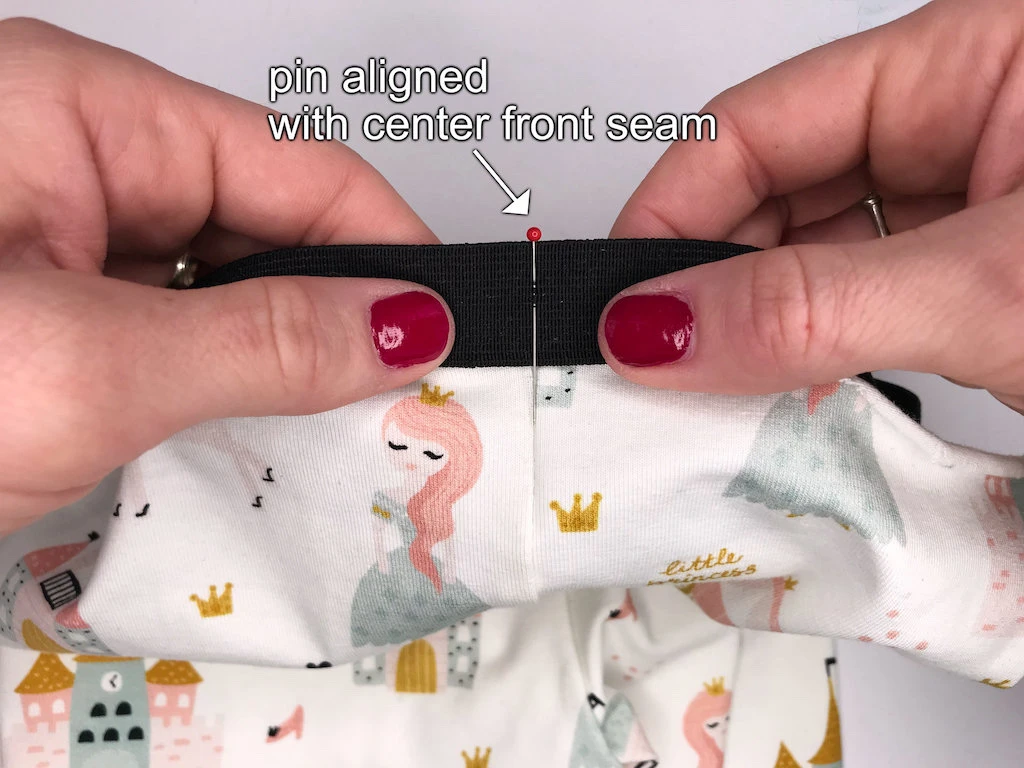 Aligning a pin to center front seams.