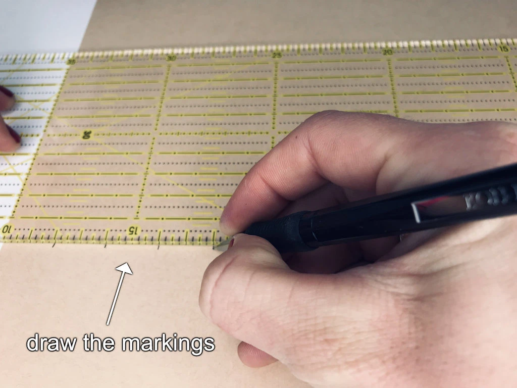 Drawing pairs of markings with a quilting ruler.