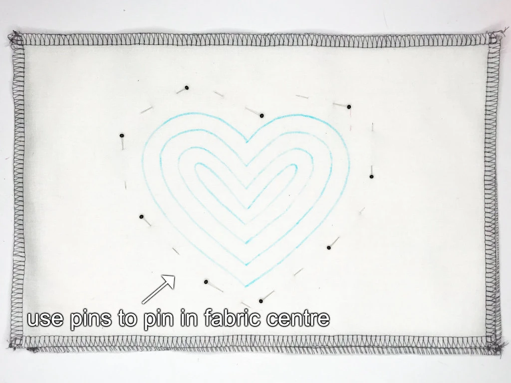 Use pins to pin in fabric centre.