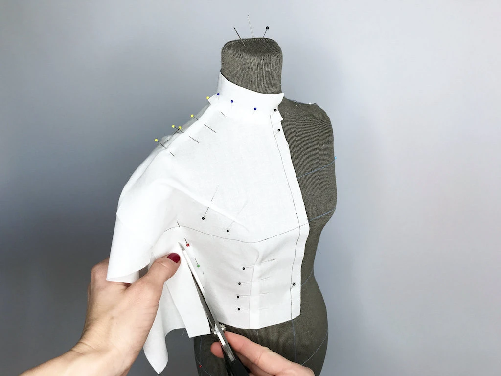 Draping a dress directly on a half-size tailors dummy.