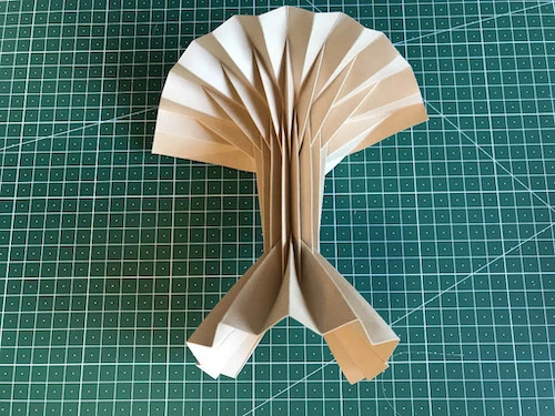 Hand pleated kraft paper.
