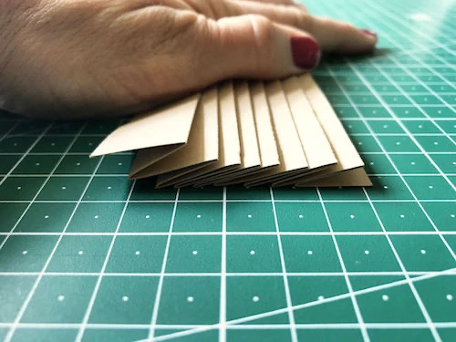 Fabric inside pleating mould. The result will be permanent knife pleats.