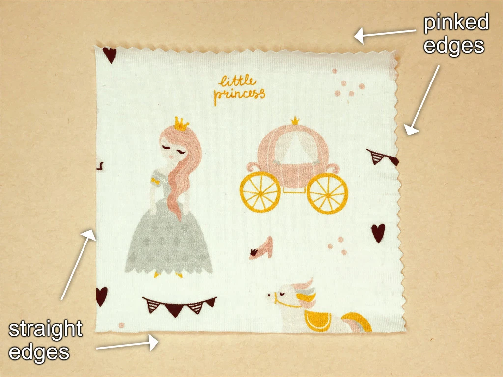 Fabric pieces with stitching and pinking sewn together and seams pressed open.