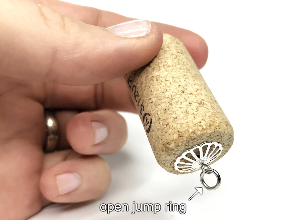 Open jump ring attached to DIY Luna Lovegood bottle cork pendant.