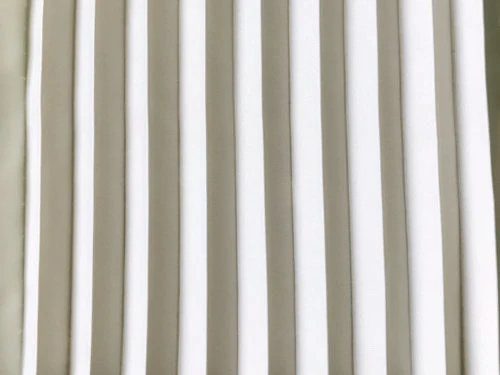 Permanently pleated micro satin fabric. Permanent accordion pleats.
