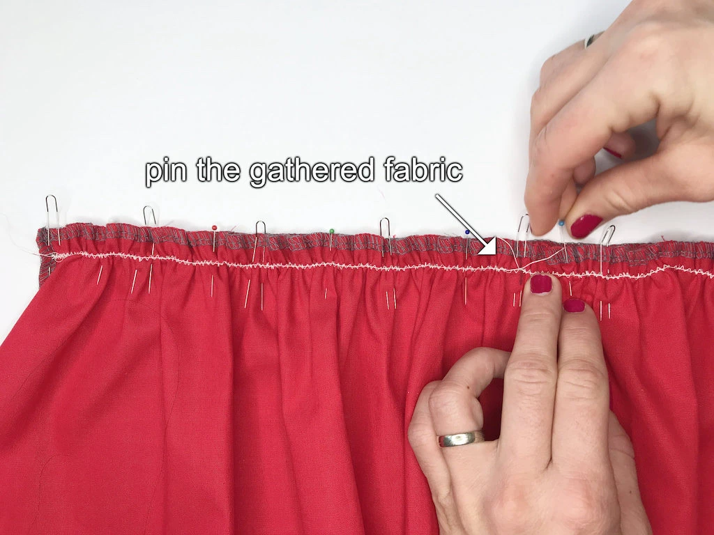 Pinning gathered fabric with classic pins and clover fork pins.