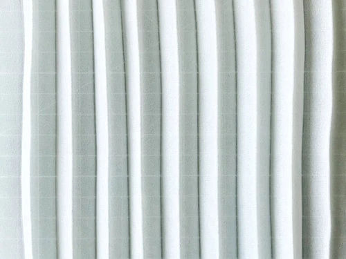 Permanently pleated georgette fabric. Permanent accordion pleats.