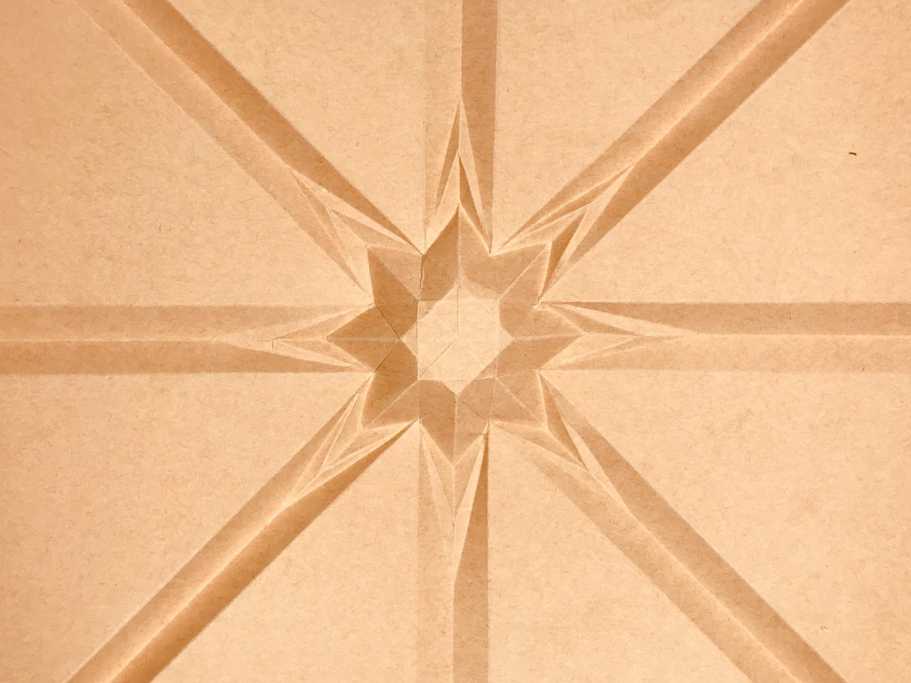 Completed star folded out of paper, rear view.
