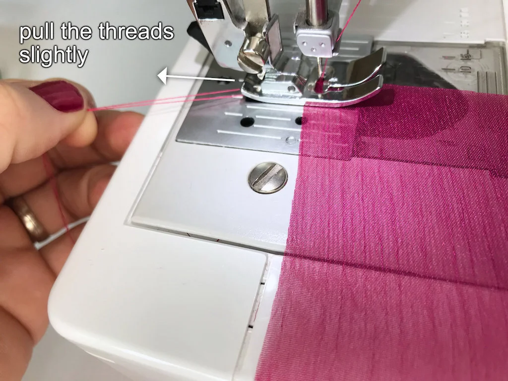 Pulling the upper and lower thread at the beginning.