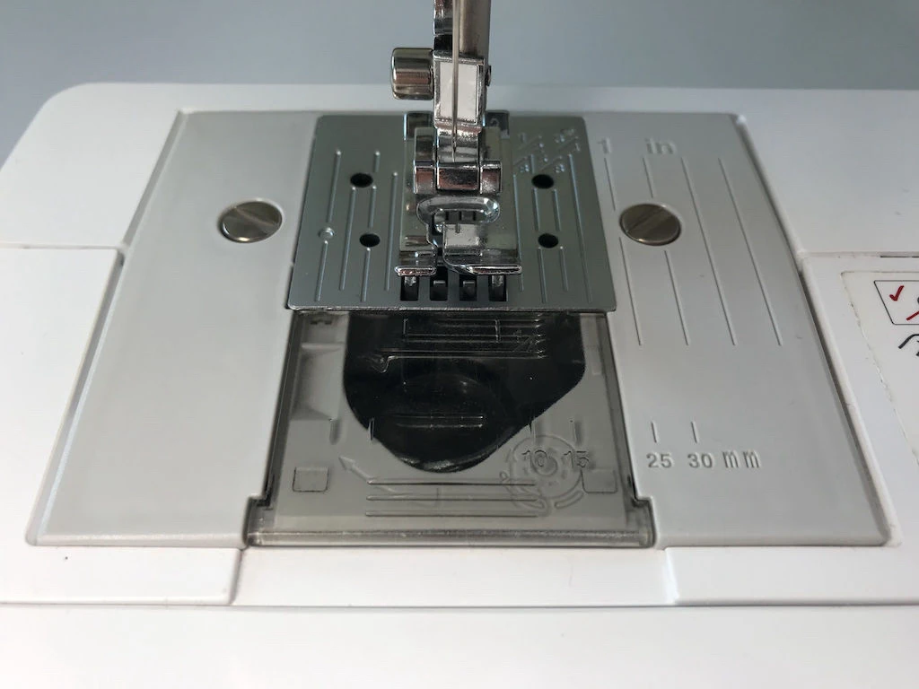 Unthreaded sewing machine prepared for sewing sewing practice sheets.