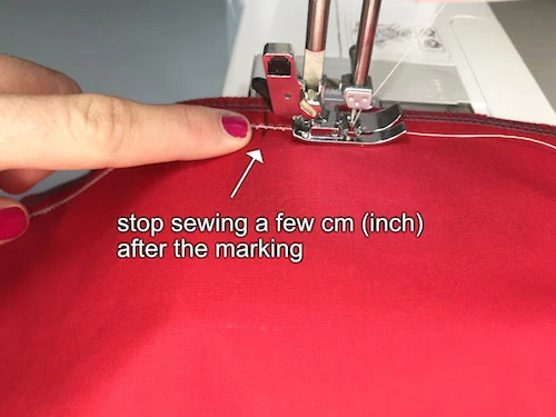 Basting thread prepared to be sewn with a medium width and length zig zag stitch.