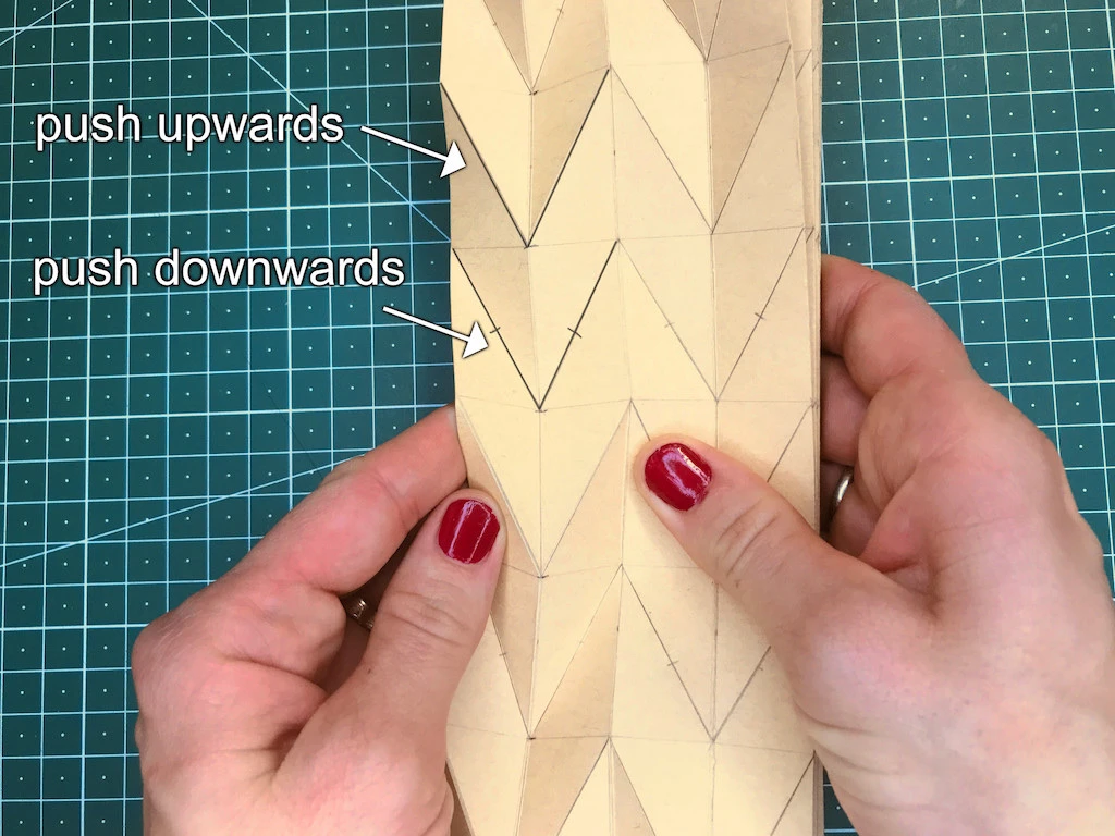 Shaping the kraft paper mould to create advanced pleats.