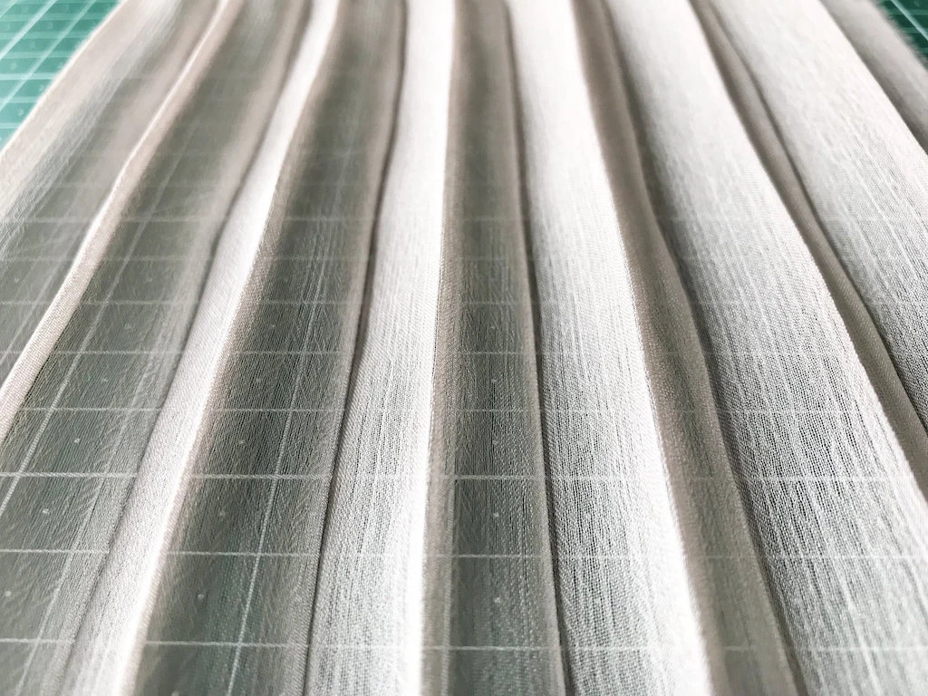 Hand pleated chiffon fabric after being wrinkled and washed.