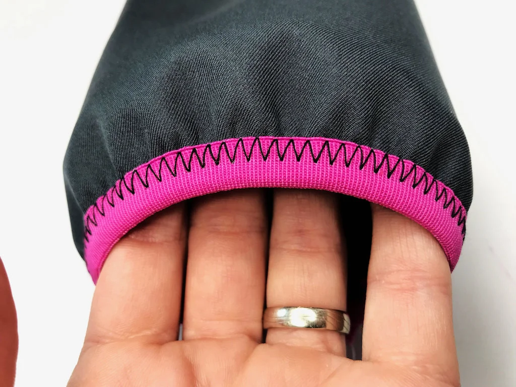 Sleeve edge with a fold-over elastic trim and decorative zigzag stitch.