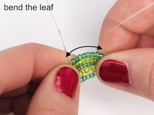 Forming a leaf by bending stringed beads.