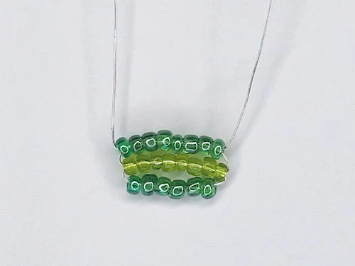 Three rows of a leaf on a Luna Lovegood earring.