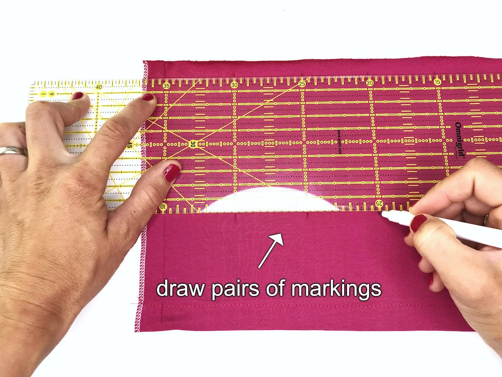Drawing marking pairs on fabric.