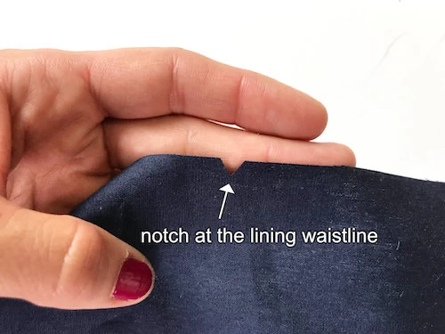 Notch on a dark blue lining fabric.