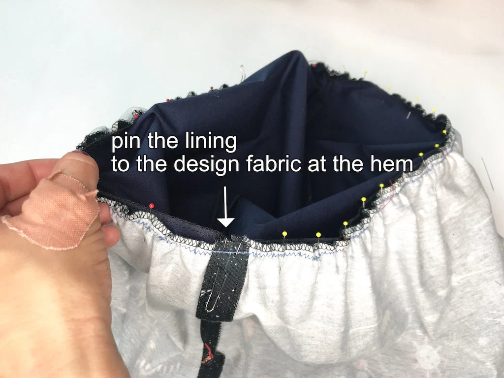 Pinning skirt design fabric and lining together to make a DIY Luna Lovegood skirt.