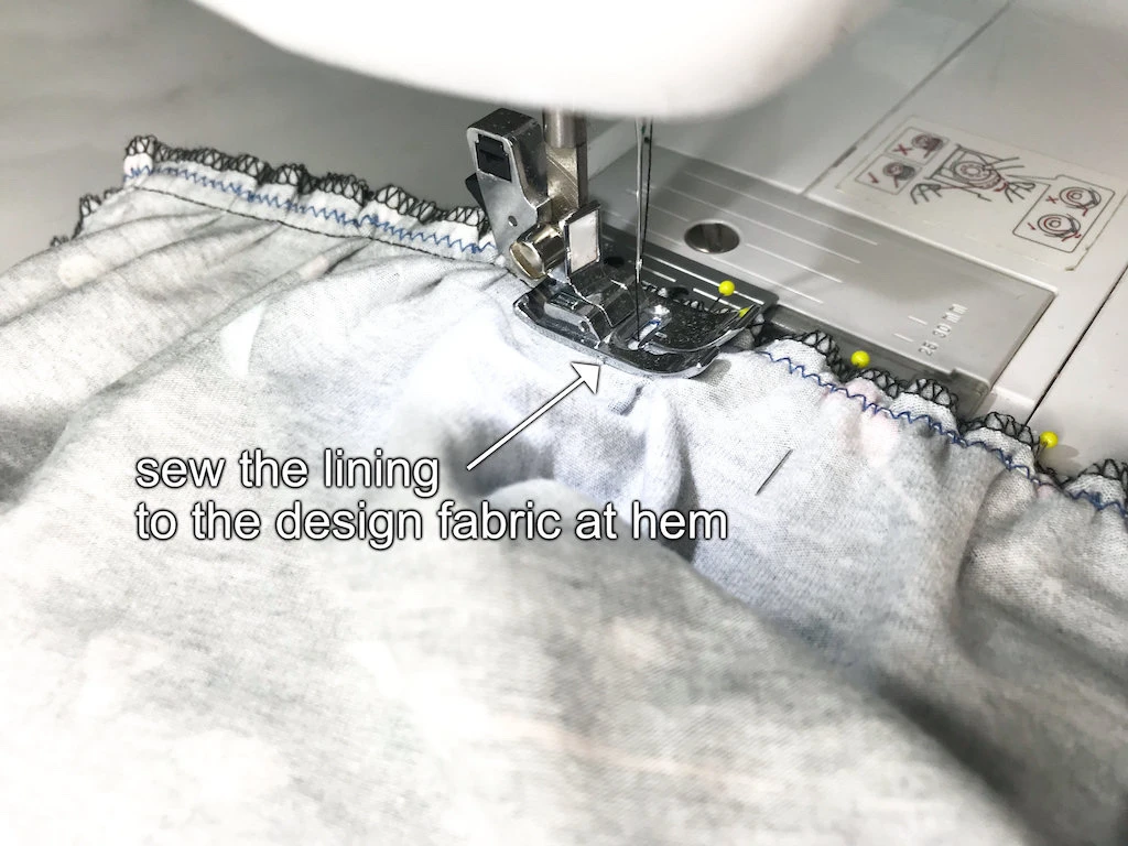 Sewing a lining and skirt together at the hem.