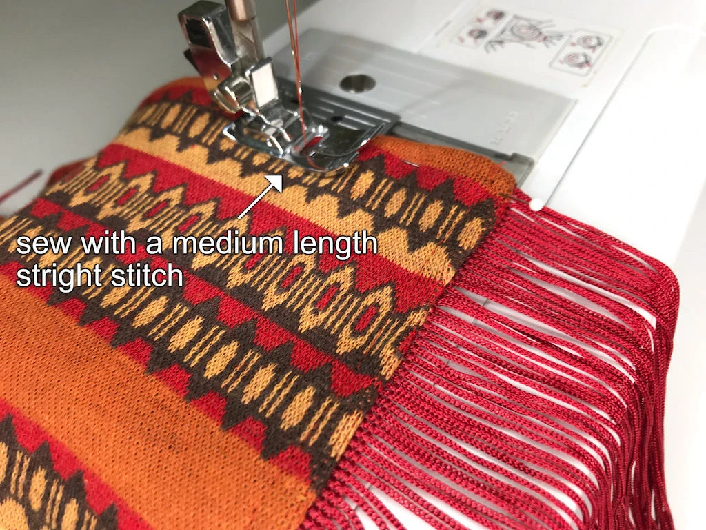 Topstitching fabric with a fringe trim.