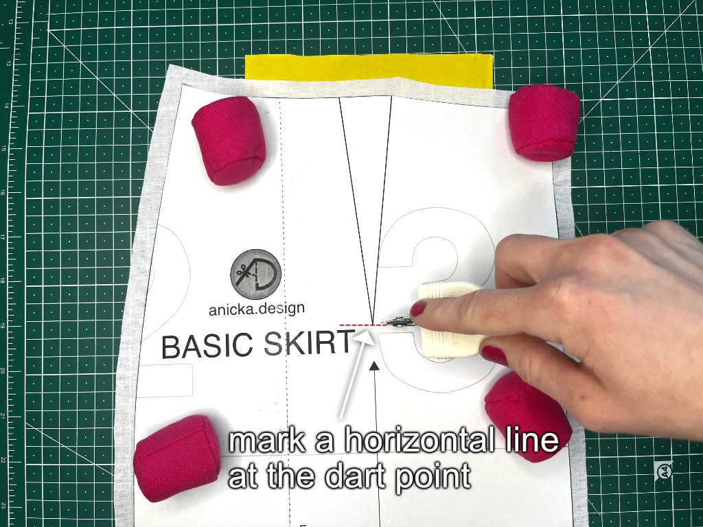 Marking the dart point with a horizontal line.